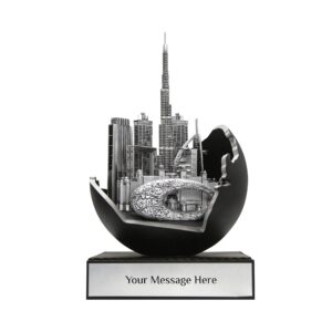 Dubai skyline sculpture featuring Burj Khalifa and Museum of the Future in metallic silver finish, emerging from an abstract UAE Map in black sphere