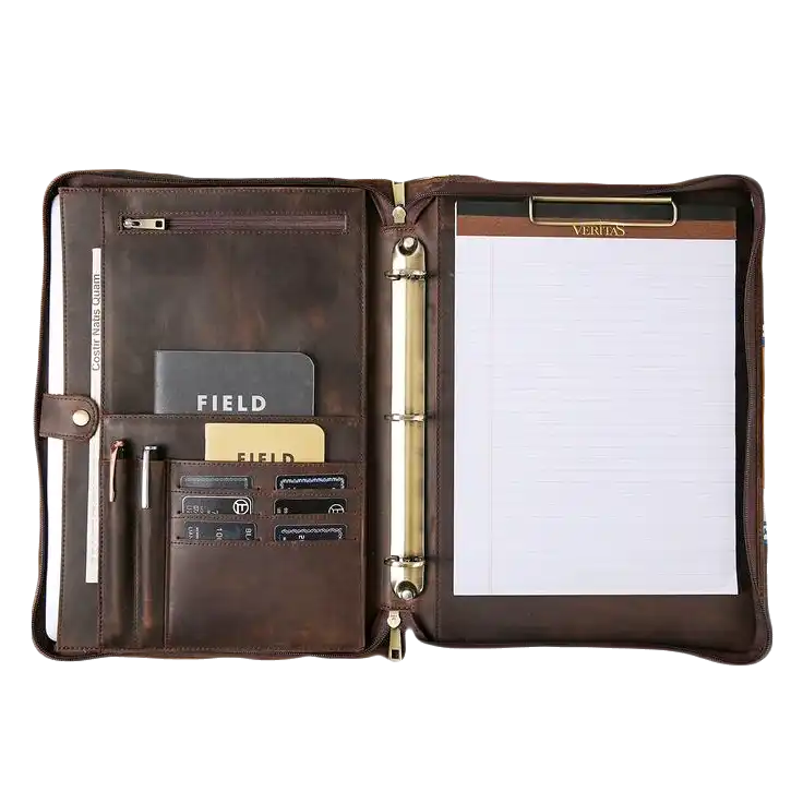 leather-executive-planner-veritas-binder An open brown leather portfolio binder with multiple pockets, card slots, and a refillable notepad Gifts for CEOs in the UAE