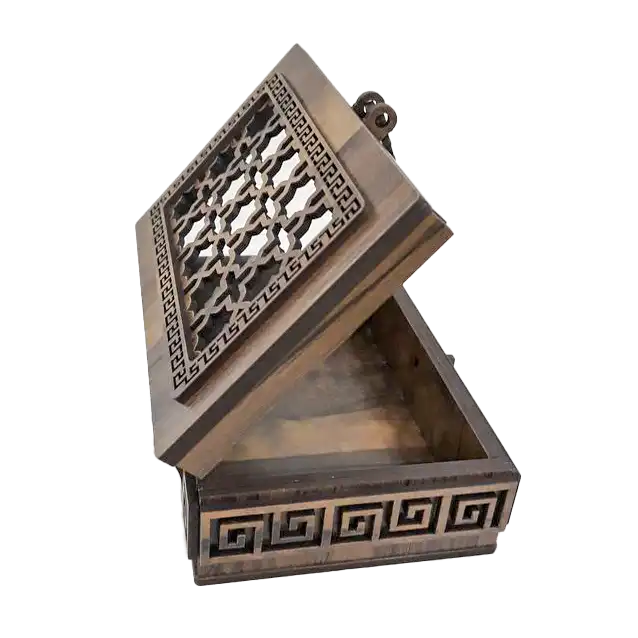 intricate-wooden-keepsake-box-hinged-lid A small rectangular wooden box with a hinged lid, decorated by laser-cut geometric patterns along the top and sides.