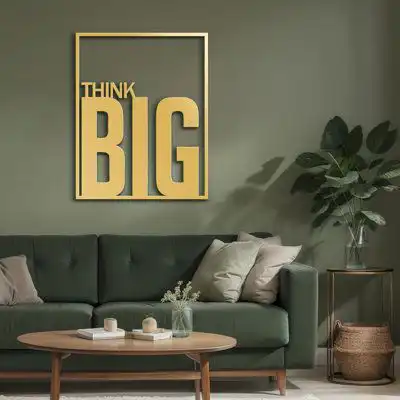 think-big-motivational-metal-wall-art A large gold-finish metal wall art piece reading ‘THINK BIG,’ framed and displayed against a green living room wall.