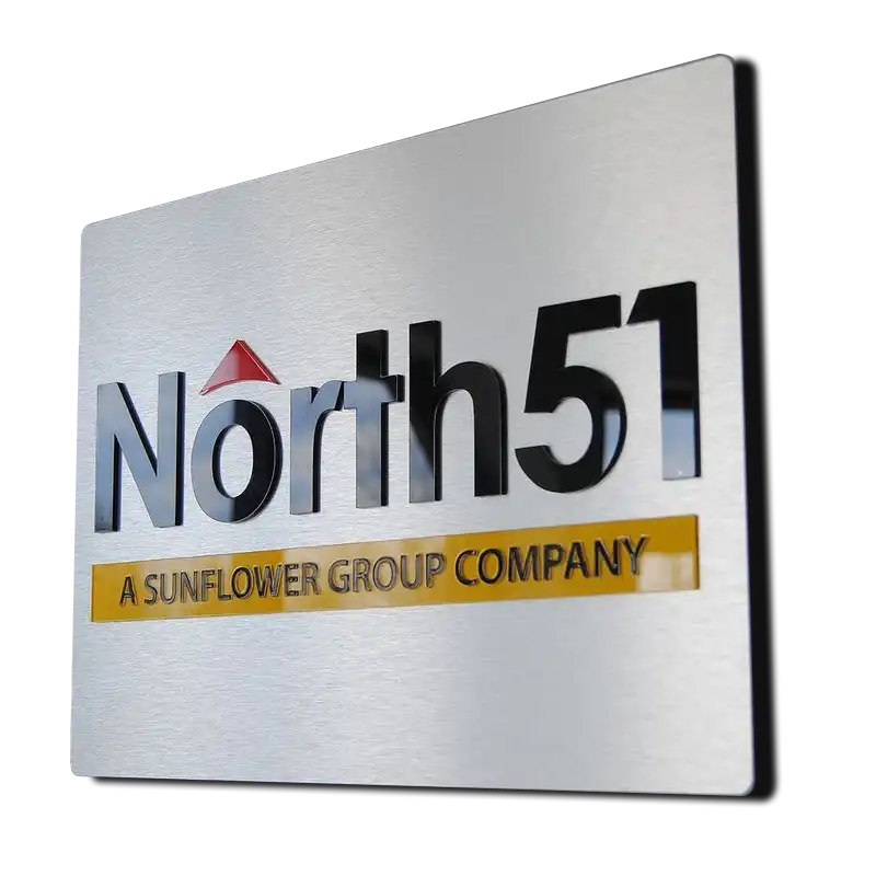 layered-metal-acrylic-company-logo A brushed silver metal sign with three-dimensional acrylic lettering spelling ‘North51, A Sunflower Group Company