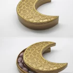 Crescent-shaped leather gift box decorated with a golden Islamic pattern, partially opened to display premium dates inside