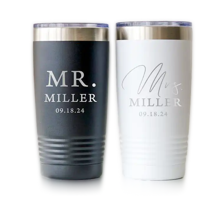 engraved-stainless-steel-tumblers A pair of black and white stainless steel tumblers engraved with ‘Mr. Miller’ and ‘Mrs. Miller,’ along with a date. Gifts for CEOs in the UAE