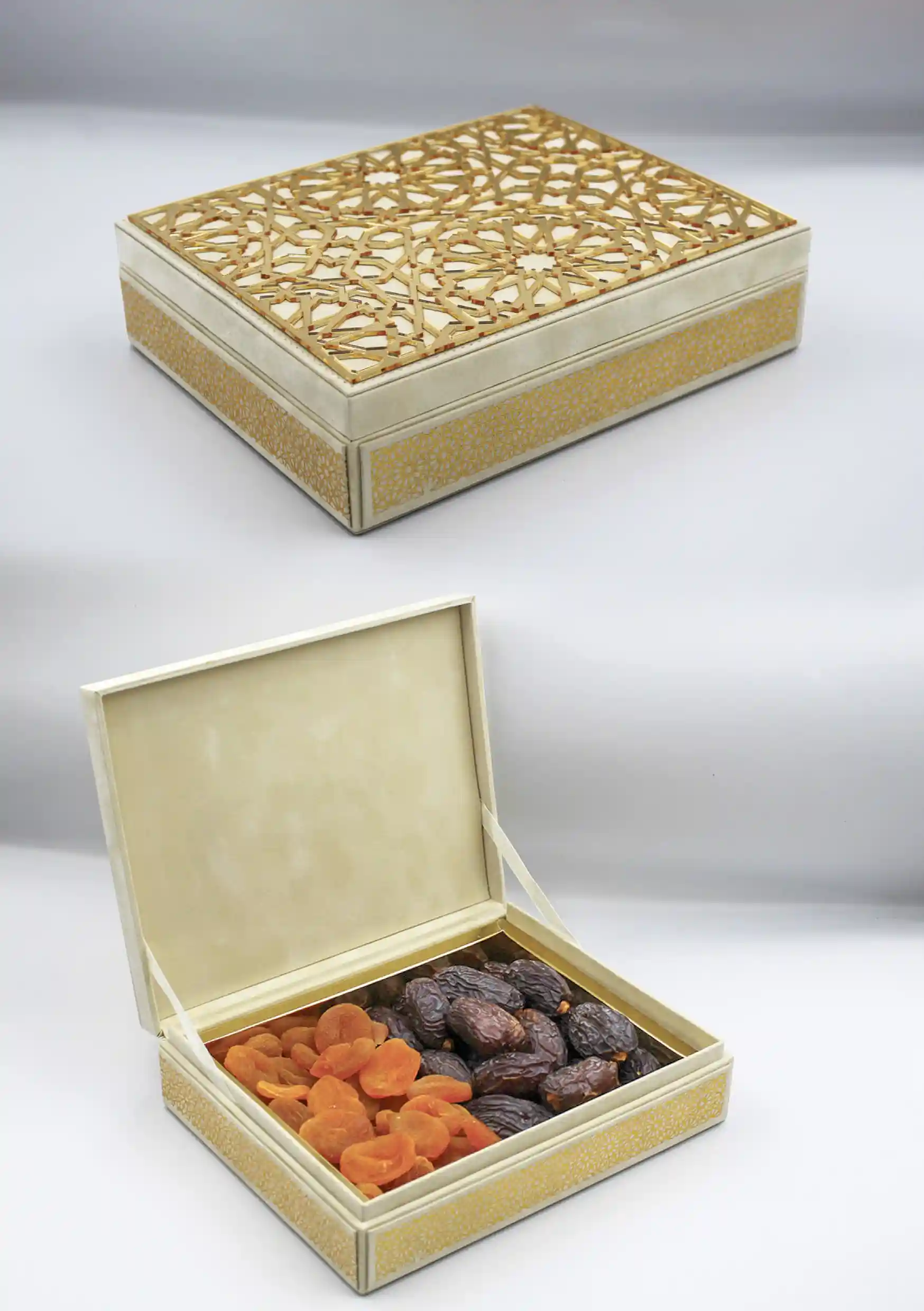 leather gift box featuring a laser-cut geometric lid, opened to reveal a selection of dried apricots and premium dates