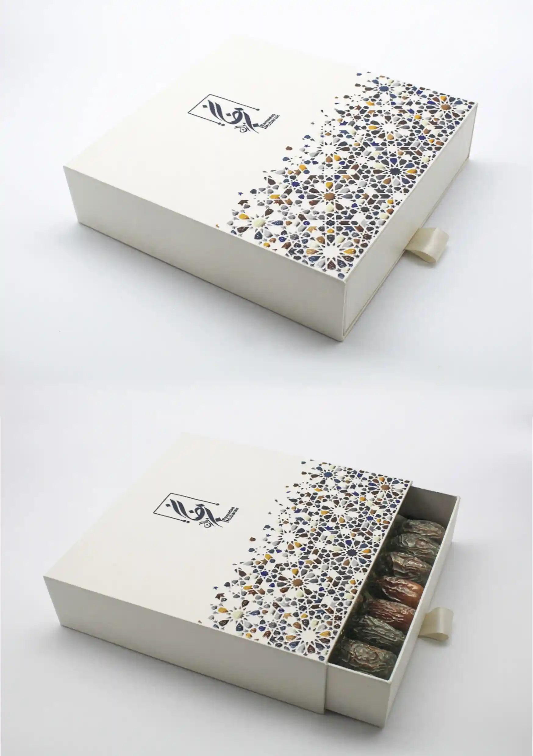 Square white drawer box showcasing a colorful mosaic-inspired design, slightly opened to show stuffed dates