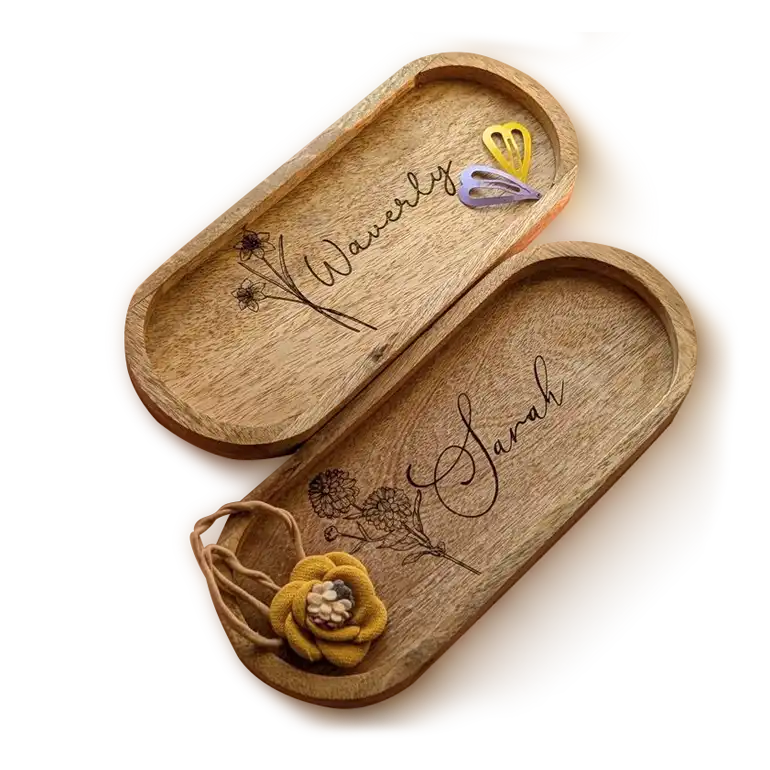 Two oval-shaped wooden trinket dishes engraved with floral accents and the names Waverly and Sarah. Gifts for Women
