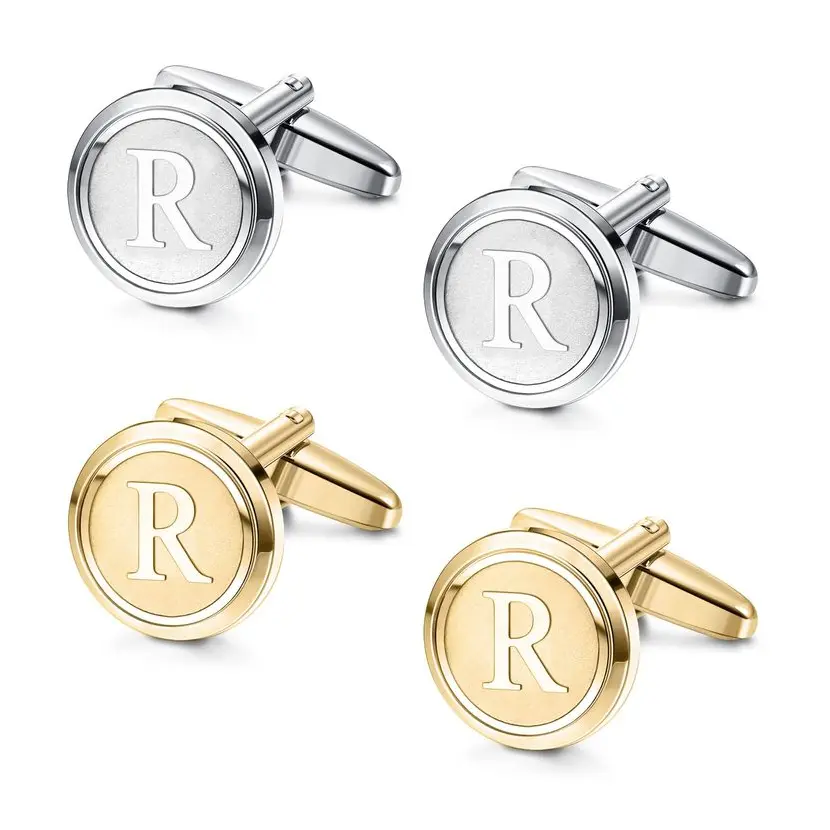 Set of round cufflinks in silver and gold, each engraved with the letter ‘R’ in a bold font Engraved gifts for men