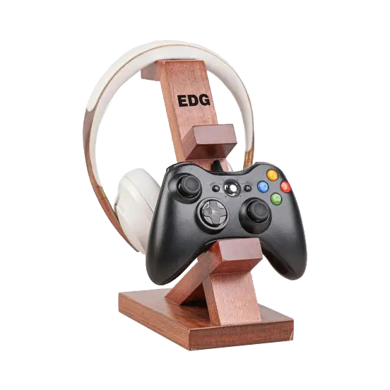 Wooden stand engraved, holding a gaming controller and a pair of headphones in one compact unit