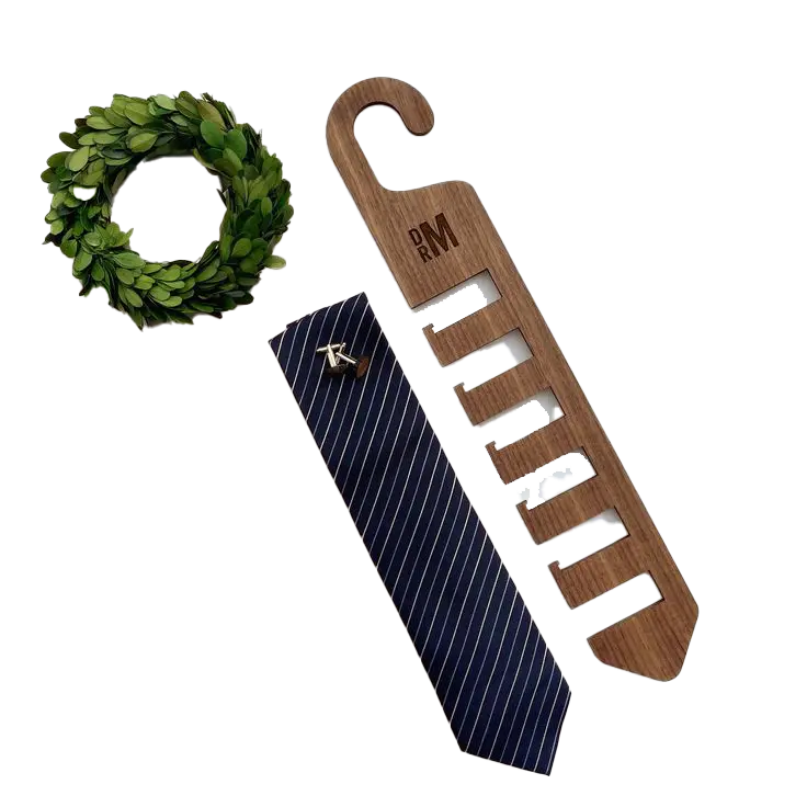 Wooden tie hanger engraved with initials, featuring multiple slots for neatly displaying ties Custom laser cutting