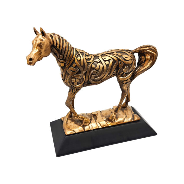 Arabian horse sculpture in antique gold finish with Arabic calligraphy, standing on a dark resin base.