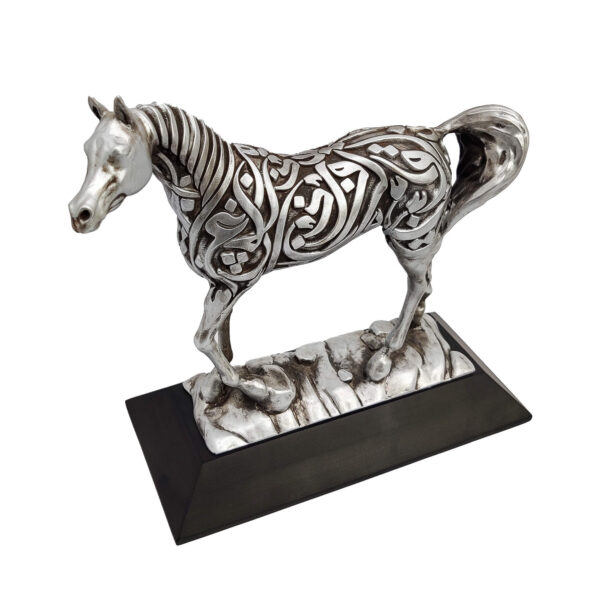 Arabian horse sculpture in antique silver finish with Arabic calligraphy, standing on a dark resin base.