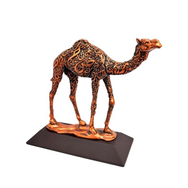Antique bronze camel sculpture with intricate Arabic calligraphy on body, standing on a flat base.