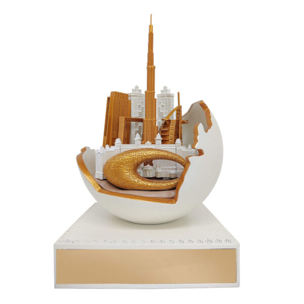 Dubai skyline sculpture featuring Burj Khalifa and Museum of the Future in gold finish, emerging from an abstract UAE Map in sphere with pearl finish