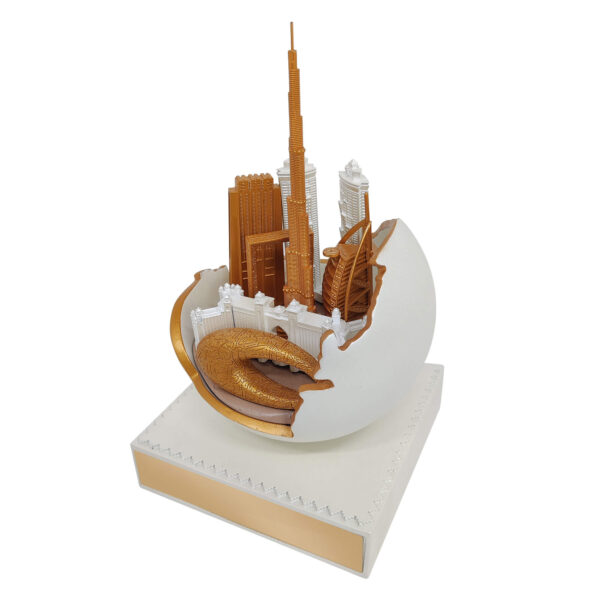 Dubai skyline sculpture featuring Burj Khalifa and Museum of the Future in gold finish, emerging from an abstract UAE Map in sphere with pearl finish