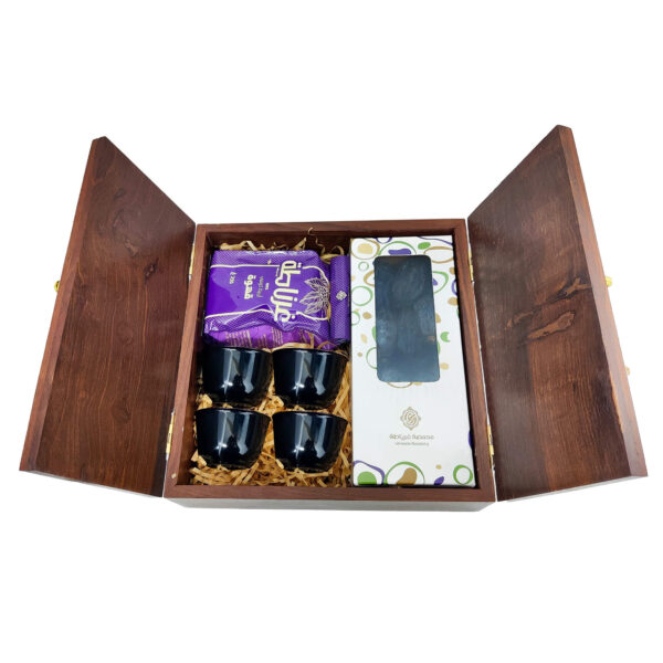 Traditional wooden door gift box open to reveal Stainless steel qahwa cups, dates, and Arabic coffee.
