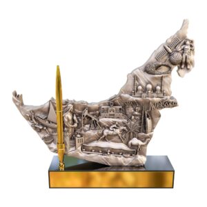 3D UAE map sculpture with seven emirates’ landmarks in antique finish, gold pen holder, and black base