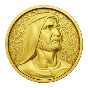 Gold coin with bas-relief of Sheikh Mohammed bin Rashid Al Maktoum on Arabic calligraphy background