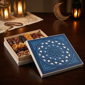 Square gift box with a deep blue lid featuring a large, intricate geometric mandala laser cutout.