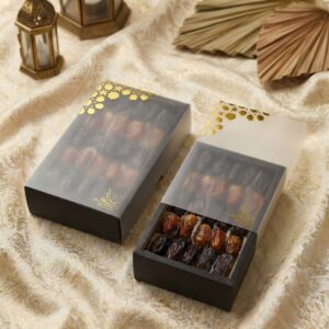 Sleek black rectangular box with a transparent window and gold foil Islamic pattern corner.