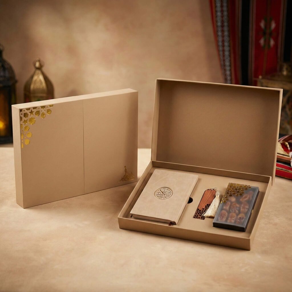 Open gift box containing velvet Quran, wooden prayer beads, and dates in a tan and gold package.