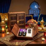 Traditional wooden door gift box open to reveal Stainless steel qahwa cups, dates, and Arabic coffee.
