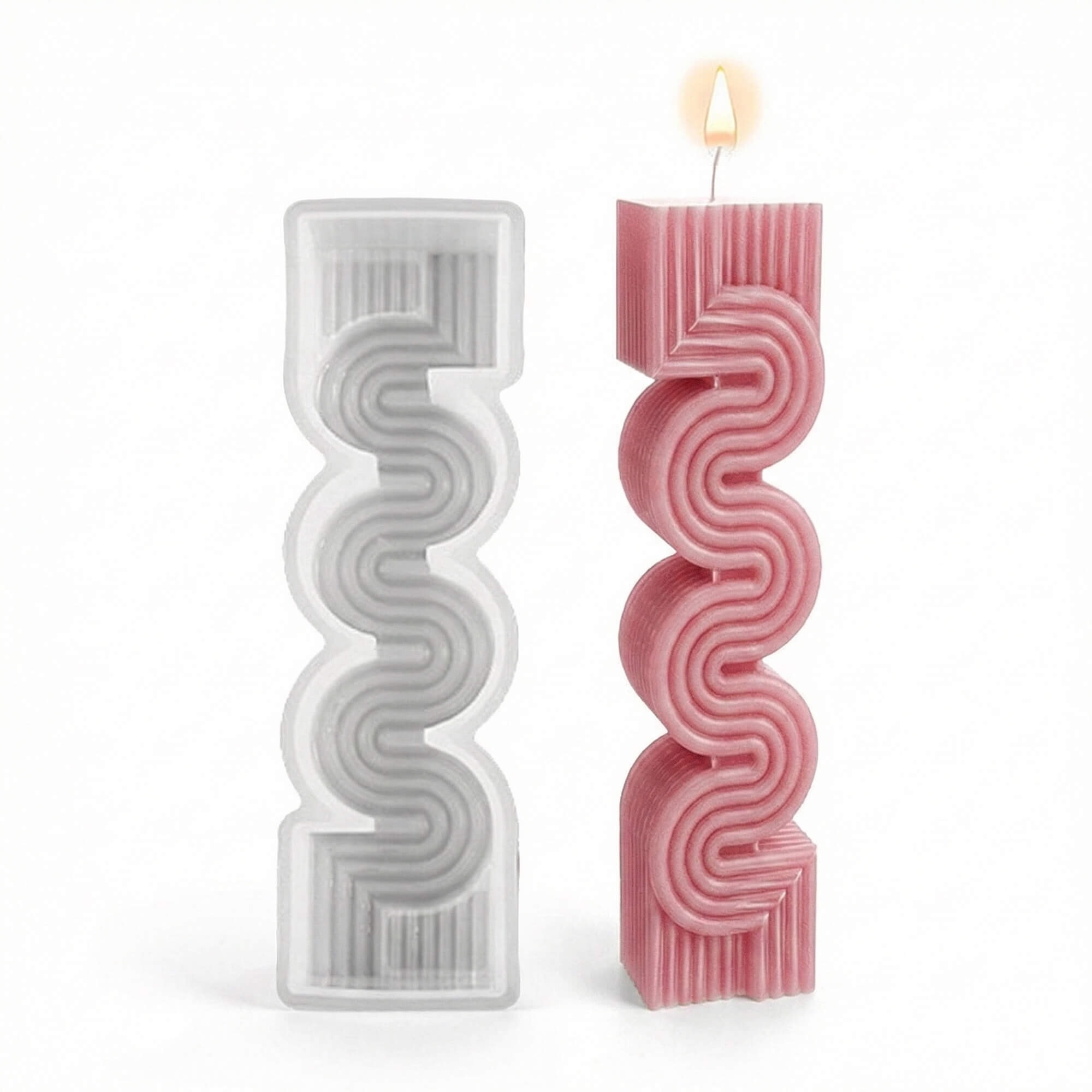 Clear silicone mold beside a lit pink wavy geometric pillar candle on a white background.