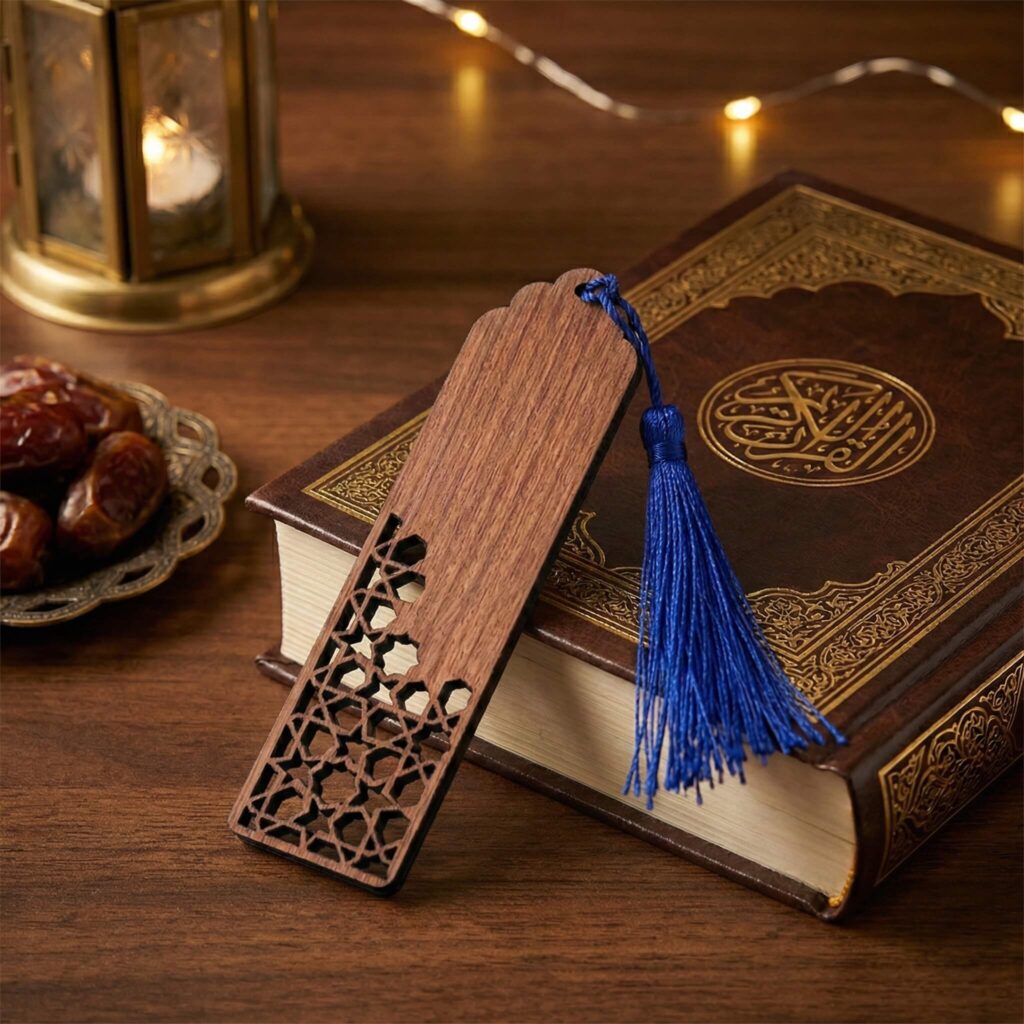 Wooden bookmark with laser-cut bottom geometric pattern and royal blue tassel.