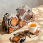 Clear casting resin square and round coasters with matching holders encapsulating natural wood slices.