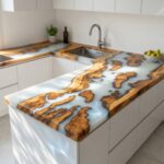 Modern white kitchen island featuring a custom countertop made of live-edge wood and white swirled colored epoxy resin.