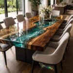 Large live-edge wood dining table featuring a deep teal swirling colored epoxy resin river center in a modern dining room.